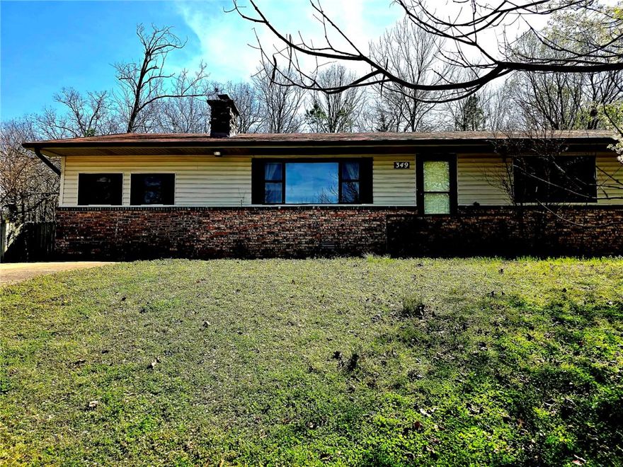 The home sits just a couple of miles of exit 58 close to Greenland. It is part of Fayetteville. It sits on .69 acre and offers a large front yard and a fenced in back yard. The garage was closed in and now is serving as a secondary bedroom with bathroom. It is a solid house that is ready for new owners to update and make their own. The home is close to all of NWA and quick trip to anything one might want to get to but still gives you some space away from the busier parts of the area. It is priced to give a new owner plenty of room to make it their own. Call today for your personal showing. 

The home is under contract but we will continue showing and accepting back up offers.