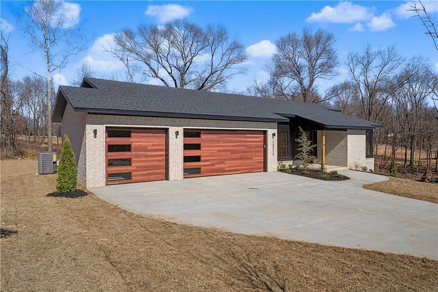 Stop looking, you've found it in this new home located in quiet and peaceful City Lake Estates between Gentry and Siloam Springs!! This home is on a one acre lot, as are all of the 27 lots in the subdivision. A perfect place to raise a family or just get away from the hustle and bustle of Northwest Arkansas, yet close enough for a daily commute to anywhere in NWA. Modern ranch with spectacular windows and views, this home is sure to impress. Large pantry off kitchen w/ extra fridge connection, massive sliding door opening to covered porch, living room built ins, private balcony off primary and primary bath includes soaking tub and 5' tiled shower, 2x6 framing, custom cabinets and Pella windows and sliding door as well. Take a look today!!