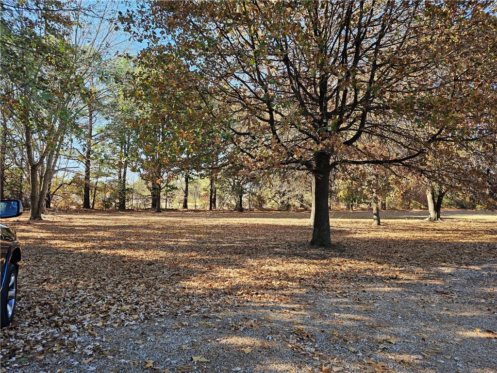 Fantastic Location 2 minutes from HWY49 on exit 73 on 2.06 acres! .3 mile from one of the busiest Walmart Supercenters, considered a "Test Store", across from Mercy Medical and Starbucks. Approx. 275 ft of road frontage on N 48th St. Strategically located just 1 minute from Elm Springs Rd intersection and a half mile from I-49, provides easy access to all of Northwest Arkansas. Don't miss out on this great investment opportunity! . Zoned Commercial C-2. Potential development opportunities include medical office, multi-family building, townhouses, bank, restaurant, or any other possibility. Surrounded by new developments. Currently, the parcel is leased as office and will come with the property "as is". New owner to remove it if needed. There is a high count of traffic and high visibility on this road. All utilities are onsite. Please do not contact the tenants.