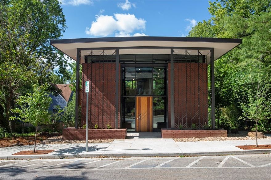 Inspired by renowned architect Fay Jones, David McKee created the architectural gem known as cosmic cowboy studio to be a multi-use, office, residential, arts & recording studio, or a long list of other possibilities. Zoning conforms to most light commercial or residential uses. Located in the heart of Fayetteville, McKee designed this building with over 16,000 dark red and bronze bricks, dark steel trim and cedar cladding to create the industrial yet modern feel.
Made with energy efficient insulated panels on the roof and polished concrete and red oak hardwood flooring.