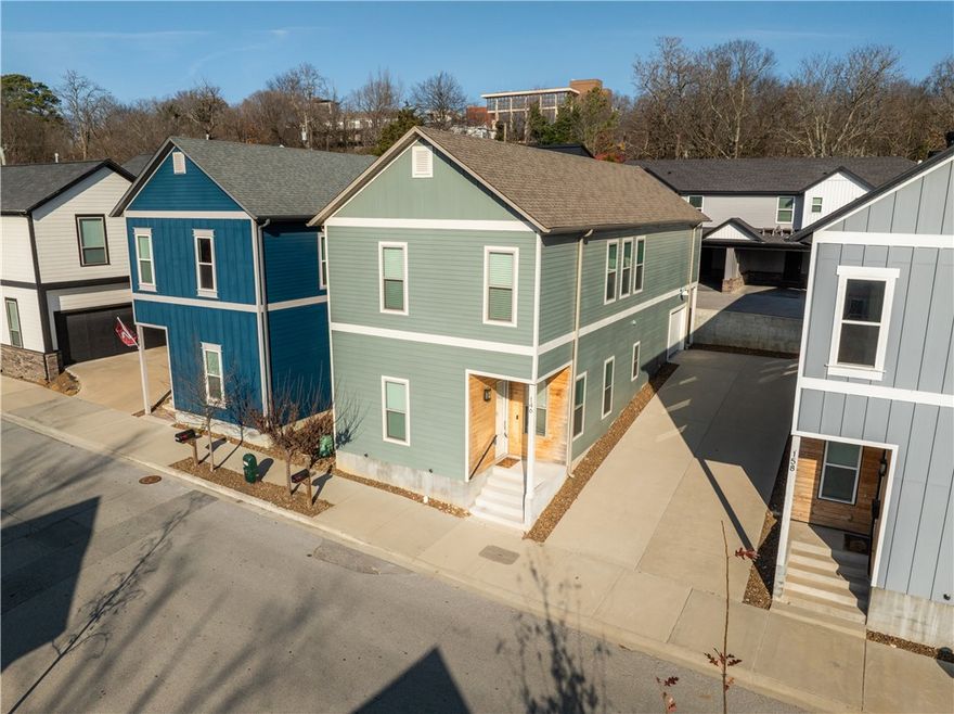 Located just South of downtown Fayetteville for this 3 bedroom, 2.5 bath home that is within walking distance to the entertainment district and restaurants, easy access to the Razorback Regional Greenway, and biking/walking distance from the U of A! Inside features quartz counters in the kitchen, bathrooms, and laundry room, lots of natural light throughout, a chef's kitchen with hood vented to the exterior, tile backsplash, and 5 burner gas cooktop, open living area, tons of custom cabinets for storage, 2" faux blinds, and ceiling fans. This home has a low maintenance exterior and a single car garage. Come see this place today!