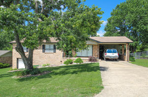 3 Bedroom 2.5 bath Double ovens, gas fireplace and large workshop. Basement has large room, could be used as game room or office.