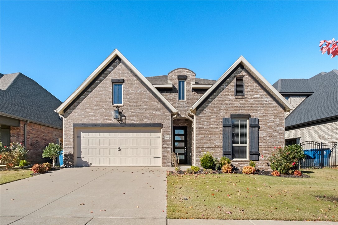 Discover modern comfort in this beautiful rental home in one on Bentonville's most desired communities with 3 bedrooms and 2 full bath. Its a spacious Open-concept layout. This home is perfect for both entertaining and everyday living. Natural lights pour through large windows. It has elegant granite countertops and high ceilings. Lawn care and maintenance included. A luxurious ensuite with double vanity, soaker tub, walk-in shower and a large closet. Fully fenced private backyard. Conveniently located just minutes from Bentonville's top dining, shopping, entertainment and schools. Washer, dryer and fridge included. Background check, credit check and renter's insurance are required. Minimum one year lease required.