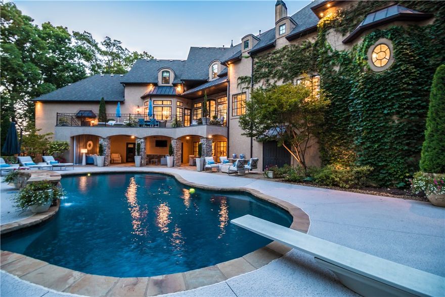 Reflecting timeless french inspired architecture & privately positioned on a premier golf front lot there is a reason this home has been featured on the cover of Traditional Home magazine. The 1.6 acre estate affords rare privacy tucked back on a cut-de-sac street & surrounded by lush landscaping & mature hardwoods. The bespoke interiors were thoughtfully designed w/the most exquisite fixtures & finishes. Resort style living at its best, w/covered veranda & gorgeous views of the unite pool & water fall.