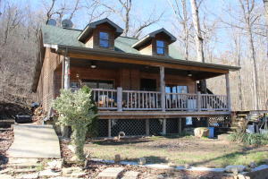 Who doesn't want a year-round spring/creek that flows through their property? Two homes with one home being a 1 bed 1 bath that could be added onto easily and the other home is a 3 bed with one bath and a sleeping or storage loft open to the kitchen area. This home could be rented on air bnb or by the month. Large barn to use for storage or a workshop with electricity. Homes share the well on the property. Only minutes to the Crooked Creek and White River for boating, fishing and swimming.