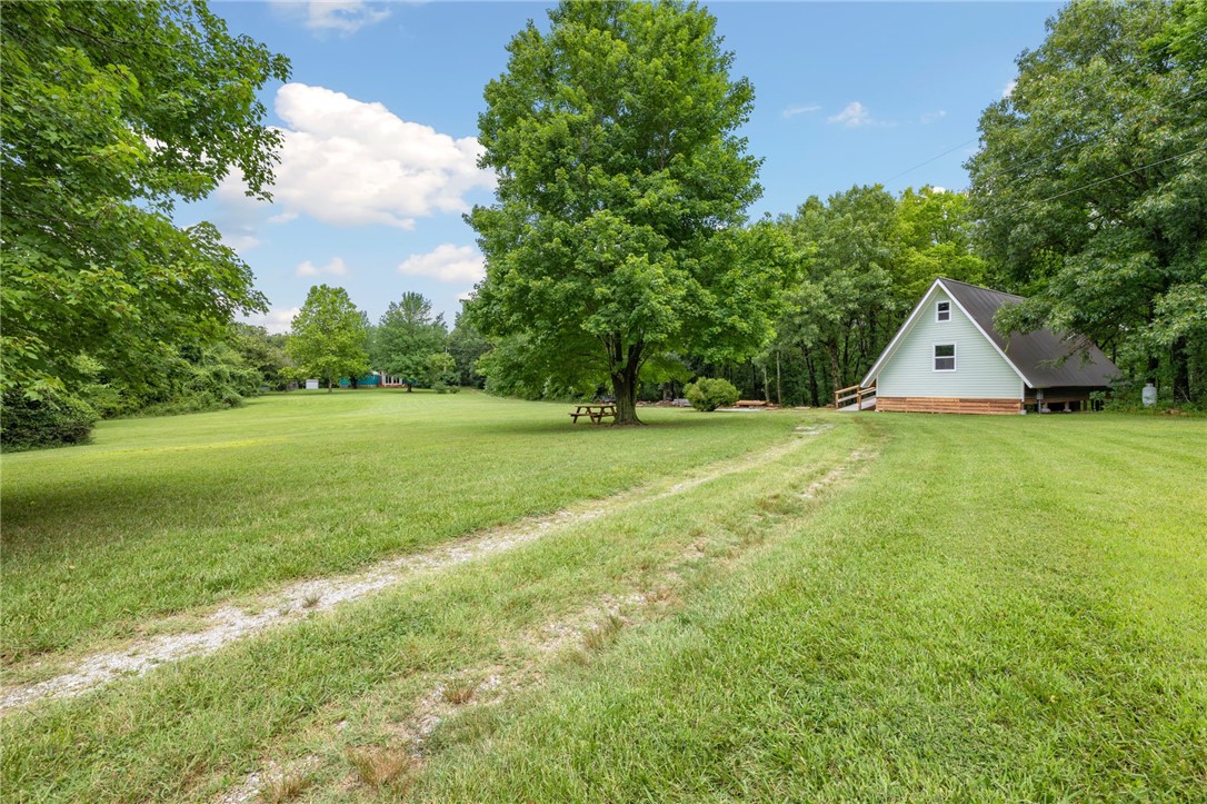 This is a must see!! 10 Beautiful Hilltop acres that's partially cleared to have a good mix of fields and woods. The property has a 1200SF A-Frame home that includes 2 Bedrooms and 2 full baths with a deck on the back overlooking the wooded hillside! This unique property also boasts 1550SF Yurts, with 2 bedrooms and 1.5baths and even comes with a Hot Tub. This would be perfect for Guest House, Mother-In-Law, or Rental. There is an abundance of wildlife for the nature lovers looking to sit on the porch in the mornings with a cup of coffee watching deer or the hunting enthusiast. Don't miss out on this opportunity to make this home your own.