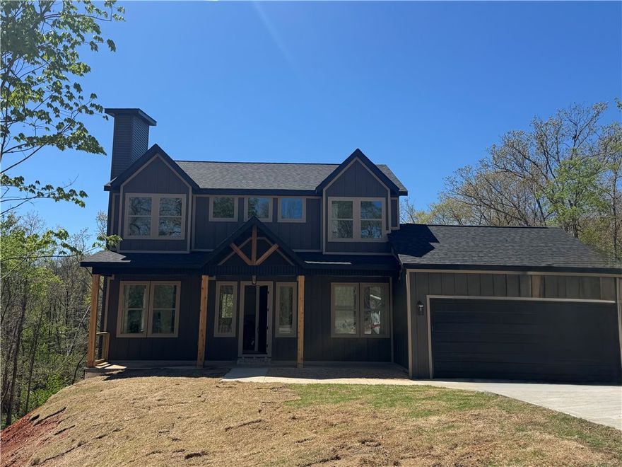 Bella Vista Living | Prime Location | Seasonal Lake Views

New construction in Bella Vista designed for comfortable, full-time living with a strong connection to the outdoor lifestyle. This 2,060 SF home offers 3 bedrooms, 2 full baths, a half bath, and a versatile bonus room ideal for a home office, second living area, or flex space. Enjoy a winter view of Loch Lomond from a setting that highlights the natural beauty of Northwest Arkansas. The functional layout provides easy flow for everyday living, with clean finishes and thoughtfully designed spaces throughout. Located just minutes from Branchwood Recreation Center, The Highlands Golf Course, Loch Lomond, and some of Bella Vista’s best biking and hiking trails. This home offers the perfect balance of modern convenience, location, and livability in one of Bella Vista’s most desirable areas.