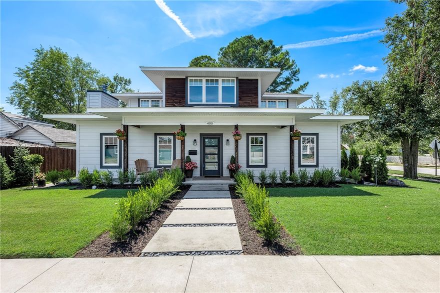 Welcome to this stunning custom built home on a .25-acre corner lot in the center of Downtown Bentonville! This impressive property boasts 3,492 sq ft of beautifully designed living space, featuring 4 bedrooms & 3.5 bathrooms, along with an additional 840 sq ft (1BD/1BA) apartment above a 3-car oversized garage. Home is highly energy-efficient & includes 12” ICF exterior walls, foam insulation, Windsor casement windows, LED lighting throughout, Fujitsu HVAC systems, whole house ERV system, & a tankless gas water heater. The main level features a luxurious primary bedroom & a versatile bonus room. The large professional-grade kitchen is equipped with a 36” 6-burner gas range, oven, quartz counters, & a built-in bar with wine fridge. Enjoy the convenience of two laundry rooms in the main house & abundant storage throughout. Custom high-end finishes add a touch of elegance, while the expansive patio with a built-in firepit is perfect for entertaining. Don’t miss this exceptional opportunity in Downtown Bentonville!