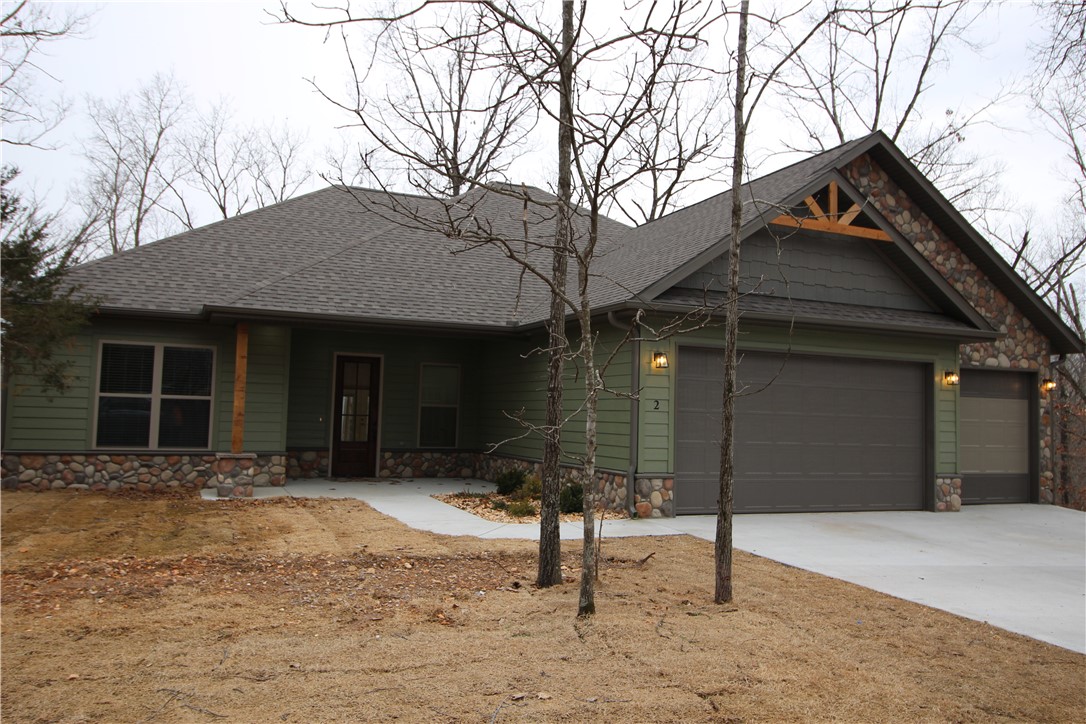 New Construction, Bentonville Schools! Modern Rustic style - a custom build with many upgrades! Gas FP, Designer light fixtures, 2 Master Suites with built-ins in closets, Media/Bonus Room, Home Office, Wheelchair accessible zero entry shower, patterned tile in laundry and powder bath, Double trey ceilings with solid wood ceiling accents, Concrete covered patio with extended sitting area, LP SmartSiding with 50 year warranty, Propane Tank ( owned) with tankless on-demand water heater, propane Furnace and Cooktop, Foam Insulation in walls and Attic, Interior Vapor barrier, Tech Shield Roof Decking, Insulated garage Doors. Zero Entry Shower, Built in Chest of Drawers in Master Closet. Barn Door. Flat .35 Acre Corner Lot, 3 Car garage, and much more!