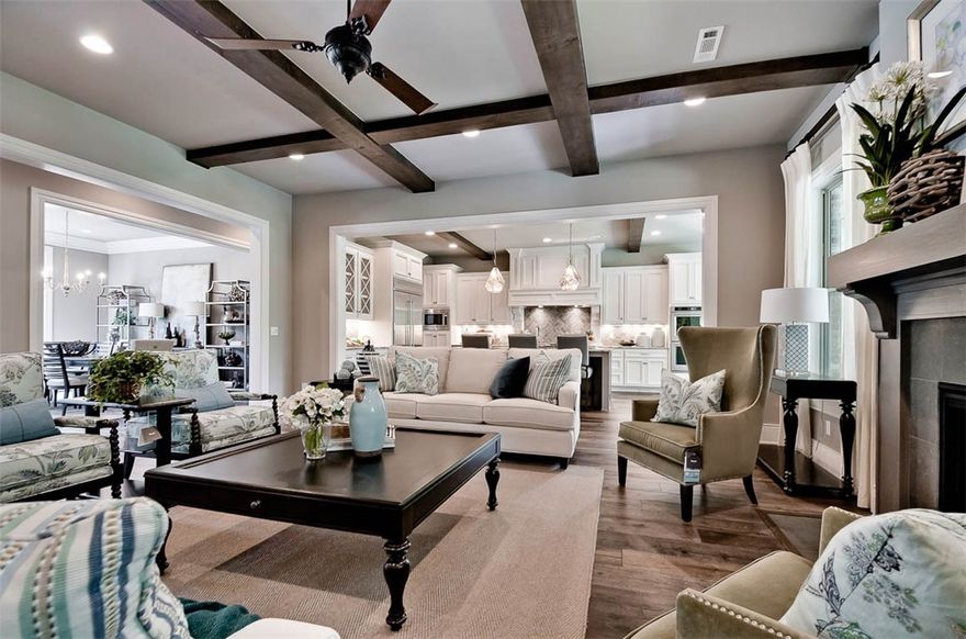 LIVE YOUR DREAM in this custom designed award winning home.  Open Living & Kitchen with granite center island is a gathering place for family or entertaining friends.  Upper end finishes: distressed wood beams, European oak flooring, light fixtures, custom designed cabinets, Kitchen Aid appliance package.    Luxurious Master Suite, walk-in shower, two walk-in closets;  Guest bedroom/bath down.  Upstairs Bonus w/Theatre package, 120 inch screen, wet bar.  Three bedrooms, 2 baths and a 2nd Bonus Room.