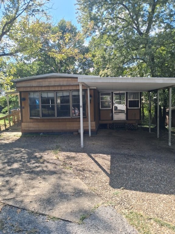 Spacious Modular Home. The inviting layout offers a cozy yet open feel with built-in shelving in the dining, coffee bar, and a bright bay window that fills the space with natural light. The kitchen is complete with a breakfast bar, dishwasher, plenty of cabinet storage, and a gas stove for home chefs, just off the living room you walk into the large sunroom for both relaxing and entertaining. The primary suite features built in dresser, dual vanities and large walk-in shower handicap accessibility. New light fixtures brighten every room and updates include a new subfloor throughout with durable square tile laminate flooring. New Elec Box with all new wiring & outlets. New hot water heater.
