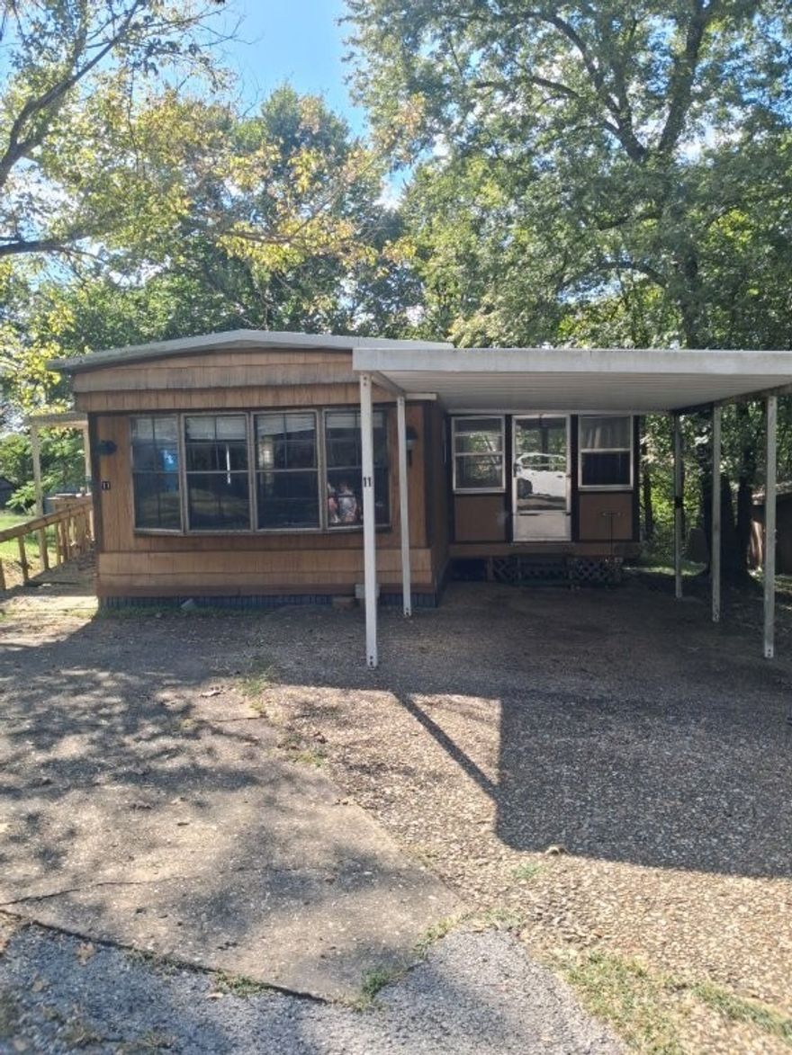 Spacious Modular Home. The inviting layout offers a cozy yet open feel with built-in shelving in the dining, coffee bar, and a bright bay window that fills the space with natural light.  The kitchen is complete with a breakfast bar, dishwasher, plenty of cabinet storage, and a gas stove for home chefs, just off the living room you walk into the large sunroom for both relaxing and entertaining. The primary suite features built in dresser, dual vanities and large walk-in shower handicap accessibility. New light fixtures brighten every room and updates include a new subfloor throughout with durable square tile laminate flooring. New Elec Box with all new wiring & outlets. New hot water heater.