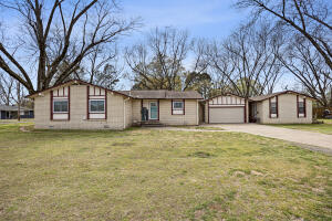 Welcome to this beautifully updated home, offering 3 spacious bedrooms and 2 modern bathrooms. Enjoy breathtaking views of the Arkansas River right from your own property! This home features a thoughtful, contemporary design with plenty of natural light and fresh upgrades throughout.Additionally, the property includes a detached studio apartment, perfect for guests, a rental opportunity, or a private retreat. Situated on 1.5 lots, there is plenty of room for outdoor living, gardening, or expansion. Whether you're relaxing on the porch, taking in the river views, or enjoying the quiet privacy of the studio apartment, this home offers the ideal blend of comfort, convenience, and serenity.