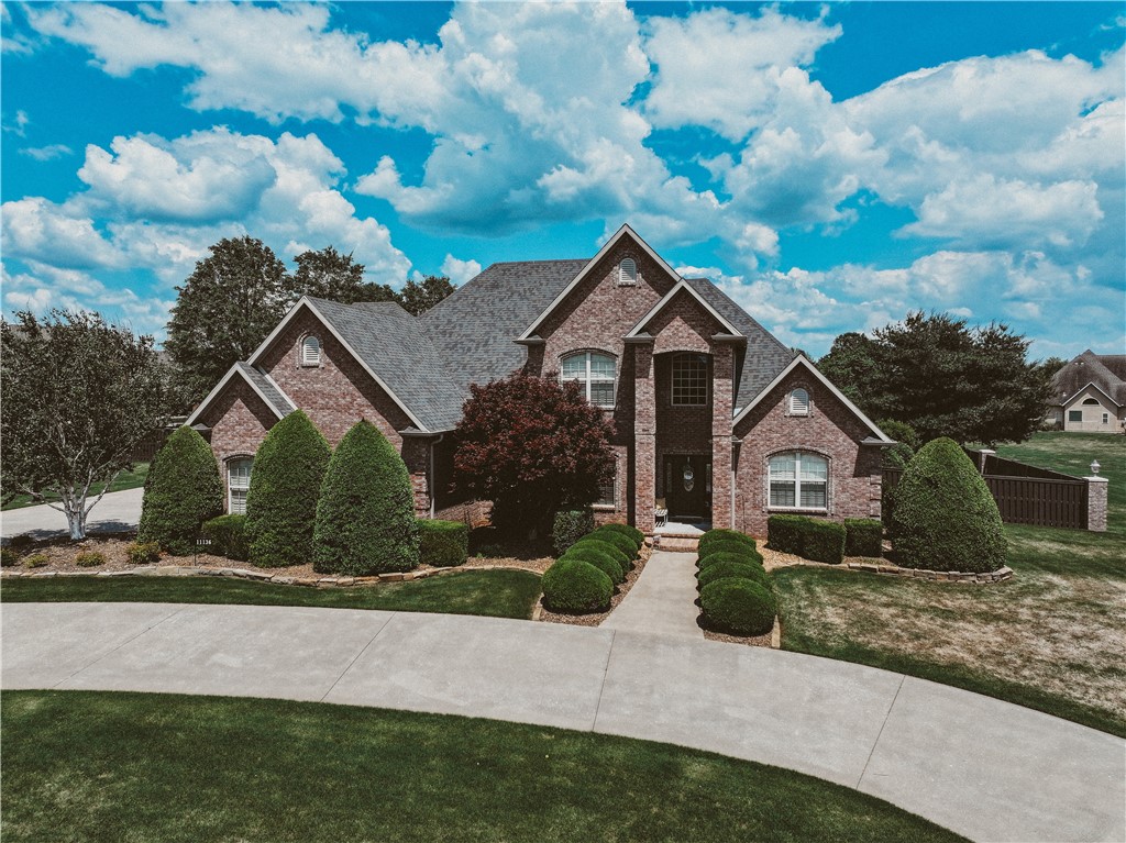 Meet Tranquility, the epitome of work life balance! This distinctive neighborhood has been a cornerstone of the community for two decades, offering a unique blend of stability and charm. Its prime location in W Bentonville renders it a truly iconic destination. As you enter the neighborhood, you are immediately immersed in a sense of warmth and belonging. The picturesque scenery, replete with manicured lawns and people at play, creates a vibrant and welcoming atmosphere. This neighborhood expertly balances seclusion and community, catering to a diverse range of preferences. The property itself boasts an array of impressive features, including 5 spacious bedrooms, 3.5 bathrooms, and a expansive 3-car garage. The sprawling 1.5-acre property, complete with beautifully landscaped grounds, further enhances the property's appeal. With its prime location, excellent schools, and abundance of outdoor recreational activities, this neighborhood is an ideal destination for peoples seeking a unique and welcoming neighborhood!