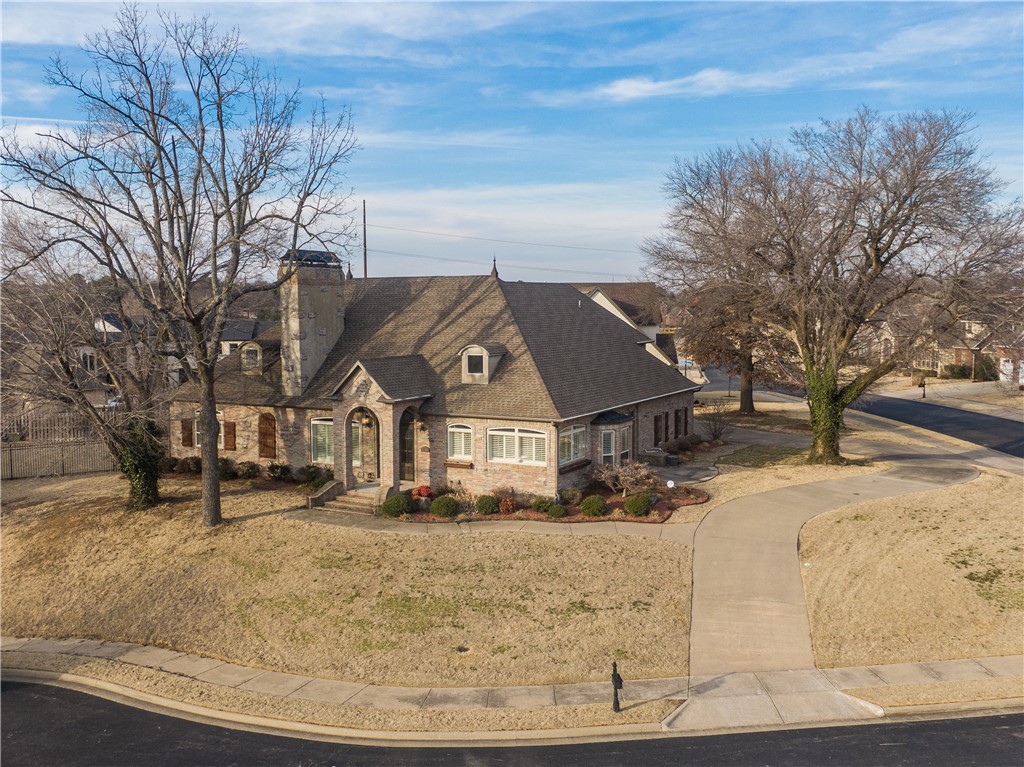 Large family home with 3 levels. Cooks kitchen hearth room with new tiled flooring in the kitchen, 6 burner gas stove, breakfast bar, pantry, plantation shutters and tons of serving space. Soaring ceilings, six bedrooms, 5 1/2 baths and remodeled basement including game room, living room, second full kitchen, 2 full baths, 2nd utility and two bedrooms. Four fireplaces, 4 car garage and two outdoor living areas. Bonus room upstairs could be 7th bedroom. Would be perfect for a dual family, in law quarters, college apartment downstairs or just a large family. Don't miss out on this opportunity! Super convenient to I-49, restaurants, schools, and entertainment.