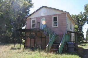 Duplex on 2 lots. The lots offer a place to build a house or another duplex. The duplex is in need of repairs.