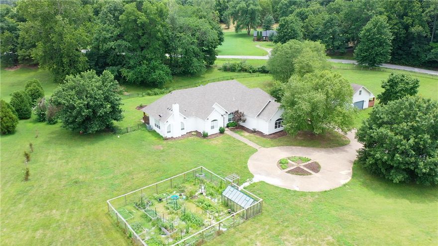 This one level, 4 bed 3 bath home boasts 3825 sq ft of living space with an in ground pool sitting on 5.85 flat acres right in the middle of NWA. With updates throughout, this home offers two living areas with wood burning fireplaces along with a flex space that will allow you to never feel cramped. The pool area is fenced, as is the greenhouse and garden area. The large property sizes of the homes in Creekside Estates give this area a country feel - bring your chickens and horses! The unfinished detached building is 2 levels with 750 sq ft and is in need of your vision! The U of A, Bentonville Square, Pinnacle Hills, and Downtown Rogers are all within 30 minutes.  Hwy 612 is a 3 minute drive if you need to use I49. At the end of the
 cul de sac there is a paved walking path down to Sugar Creek and The Creeks Golf Course. 

This property has a tax record showing Cave Springs, mailing address must say Springdale and it is in Bentonville school district.