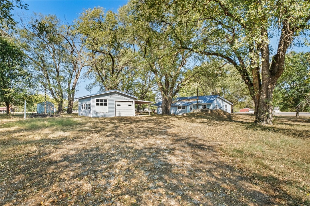 Fixer Upper home near the Pea Ridge City Park on a great level lot with large trees. This property has potential for different uses, it could either be used as a great homesite for a new home or the home could be repaired to live in. The lot has preliminary approval from the city to split into 2-3 lots. This split has not been done because the sellers would like to leave this up to a future owner to decide if they wanted to proceed with a lot split. The interior of the home is a project currently and it does need quite
a bit of work. The bathroom was remodeled by the previous owner. This will most likely need to be cash or a conventional loan. Pea Ridge City Park adjoins the back fence of the property for a nice walking trail and park!