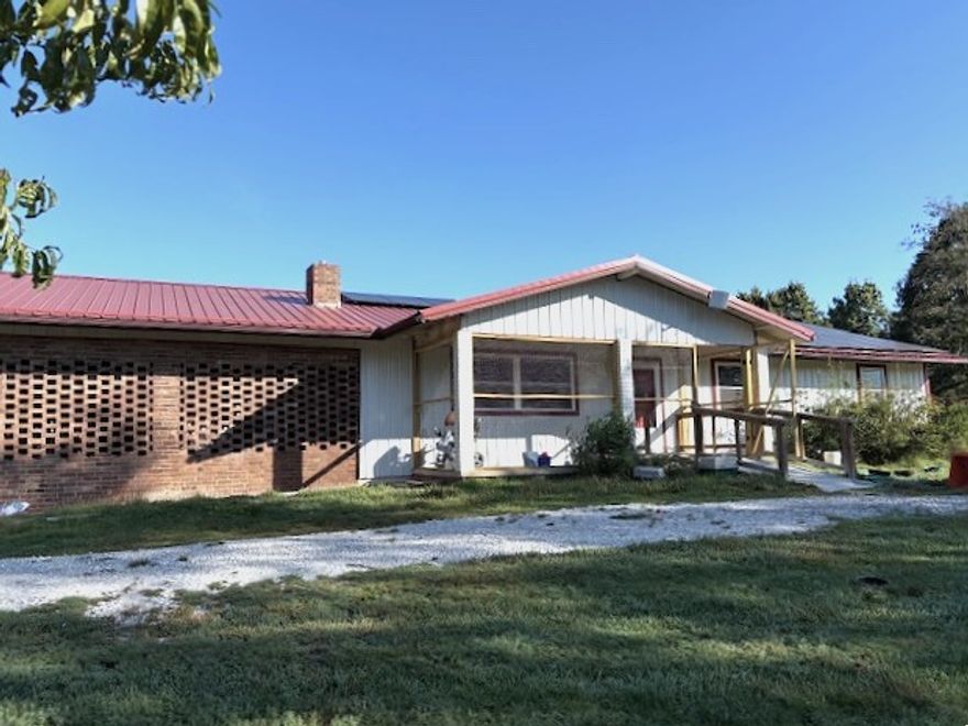 Charming home on 7+ Acres in Bergman School District! Enjoy peaceful country living in this spacious 3 bedroom 2 bath home set on over 7 acres. Featuring a spacious kitchen perfect for family gatherings, and a cozy gas fireplace for chilly evenings. Relax and unwind in the bright sunroom overlooking the private setting. Recent updates include a newer roof, windows, metal siding, and stylish new laminate flooring. Energy efficient solar panels help keep utility costs low. With plenty of space indoors and out, this property offers comfort, privacy, and convenience-all within the desirable Bergman School District.