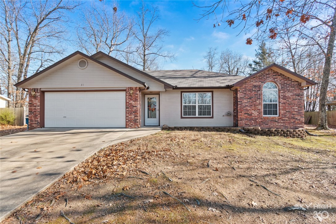 Beautiful and well maintained home with a large, level yard that is very private. Located within Bentonville School District! Tray ceiling in Living room with crown molding throughout most of the home. Covered deck. Wood burning fireplace for those cold winter nights. New Central Heat and Air, new water heater, new lighting and fixtures, new roof. New 6 foot wood Privacy fence 2019. New electric in summer 2019 including new wiring, electrical panel and home-surge protector with lifetime warranty. Home has smart home features to turn on and off lights, tv, heating/cooling, etc. Refrigerator, Hot tub and grill awning do not convey.