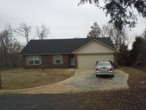 Nice oak cabinets, open floor split, vaulted ceilings in livingroom, new interior paint, wood & tile floors, rear porch rear view. Rear gutters, end of street.
