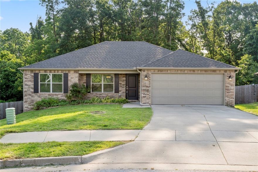 Looking for a backyard oasis? This home sits on a lot about twice the size on many of its neighbors and offers serene privacy with a wall of dense trees in the backyard. Built in 2020, the home features an upgraded shower in the primary bathroom, walk-in primary closets, granite countertops, 2 car garage, fenced in backyard, and split floor plan. Located minutes from downtown Rogers, Beaver Lake, schools, parks, restaurants, trails, and much more!