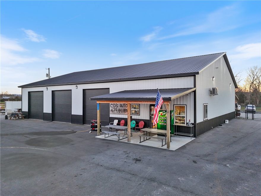 Discover exceptional commercial potential with this 2024 construction located on Hwy 16 in the growing Elkins market. This versatile 5-bay shop features an open floor plan suitable for a wide variety of businesses—mechanical, service, fabrication, storage, or investment.

Inside, you’ll find overhead heat, a dedicated office space, and a full bathroom, offering comfort and functionality for day-to-day operations. The building sits on a fully fenced property, with standard fencing in the front and tall, high-security fencing in the back, perfect for equipment or inventory storage.

Exterior features include an asphalt driveway and gravel parking areas in both the front and rear, providing easy access for employees, customers, and larger vehicles. With prime Hwy 16 road frontage, this property offers outstanding visibility and accessibility.

A rare opportunity to own a clean, modern commercial shop in a high-growth area—ready for your business to move right in.