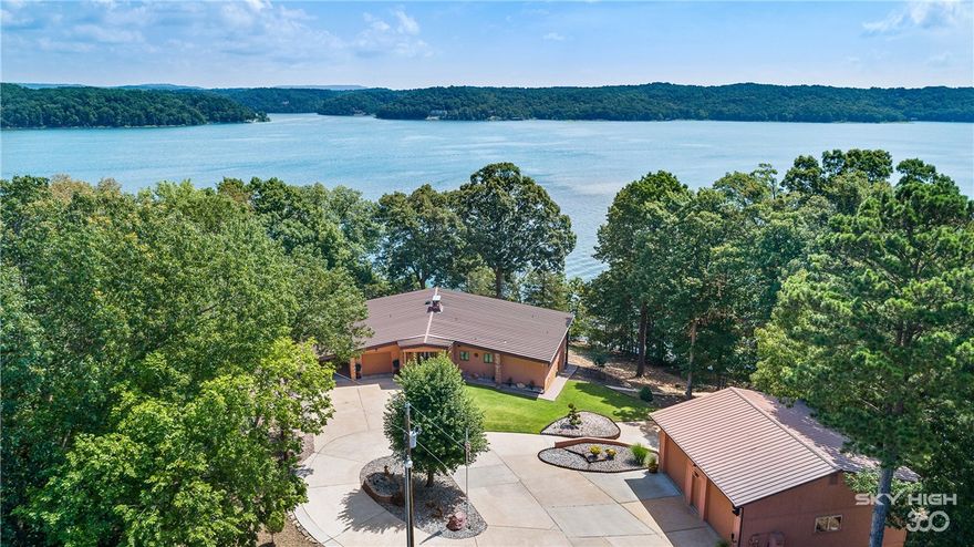 Magnificent gated custom lake home on .83 acre lot just at the water’s edge… Lush grounds & breathless views offer a private tranquil setting minutes from town. This exquisite home features 3 Bedrooms, 3 baths w/2 living areas and formal dining. Well thought out design for entertaining and featuring expansive decks with gorgeous views of Beaver Lake. One of a kind concrete constructed Carriage House w/2 main level bays & additional lower level bay for that hobby enthusiast. Step out your door & stroll to the family owned 3 slip boat dock w/swim deck, 3 lifts & electric.  Unsurpassed perfection with approximately 950 feet of shoreline that you will not find anywhere else! Call to schedule a private showing.