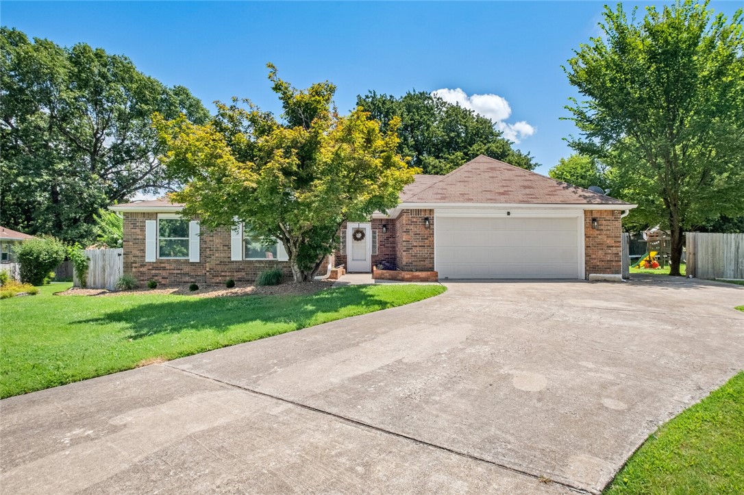 Lovely Prairie Oaks gem with charm and convenience! Enjoy single-level living in this 3-bedroom, 2-bath home featuring a vaulted ceiling living room with brick fireplace, split bedroom layout, and spacious closets in the primary suite. The eat-in kitchen and dining area flow into the living space create an open concept that makes it easy for hosting. Outside, the flat, generous yard offers room for gardening or play, with plenty of room to entertain or relax. Located on a quiet street just moments from neighborhood trails and parks, and within easy access to Hwy 412/I-49 for commuting, shopping, and dining. Perfect for a retired couple seeking low-maintenance peace or a young family starting out.