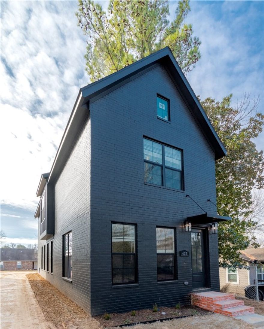 Brand new all-brick luxury only minutes from the Fayetteville Square, Farmers Market, University of Arkansas, a wide variety of dining options, shopping, biking/walking trails, Dickson St, and all the vibrant amenities of Downtown Fayetteville! The home boasts 3 spacious bedrooms, each with its own private bath, and 3.5 baths total. The main living area, kitchen, stairs, and hall feature beautiful engineered hardwood floors, adding elegance throughout. The gourmet kitchen is a chef’s dream, with a large island, luxury 3cm quartz countertops, and a high-end gas range. Custom-built cabinets extend to the ceiling, and gorgeous trim and cased windows add to the overall sophistication. This home includes a 1-year builder’s warranty. Don’t miss your chance to own this beautiful, move-in-ready home in a prime location!