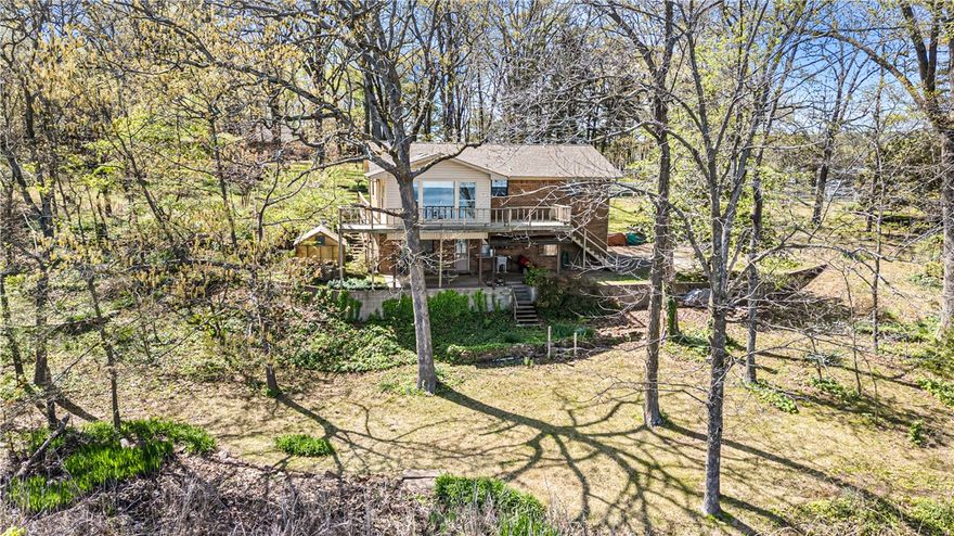 Discover the perfect waterfront escape on Lake Dardanelle in the heart of the Arkansas River Valley. This 3-bedroom, 2-bath, 2,000+ sq ft home, located just 8 minutes from Dardanelle, offers nearly an acre of peaceful living. Enjoy captivating lake views from the expansive back deck or relax in the sunroom year-round. Inside, spacious bedrooms, abundant natural light, and an open layout set the stage for unforgettable gatherings. Wake up to serene waterside sunrises and end your day with tranquil sunsets. Don't miss this rare opportunity to own a prime piece of lakeside real estate with easy access to boating, fishing, and local amenities. Live the life you've always dreamed in this scenic Arkansas retreat.