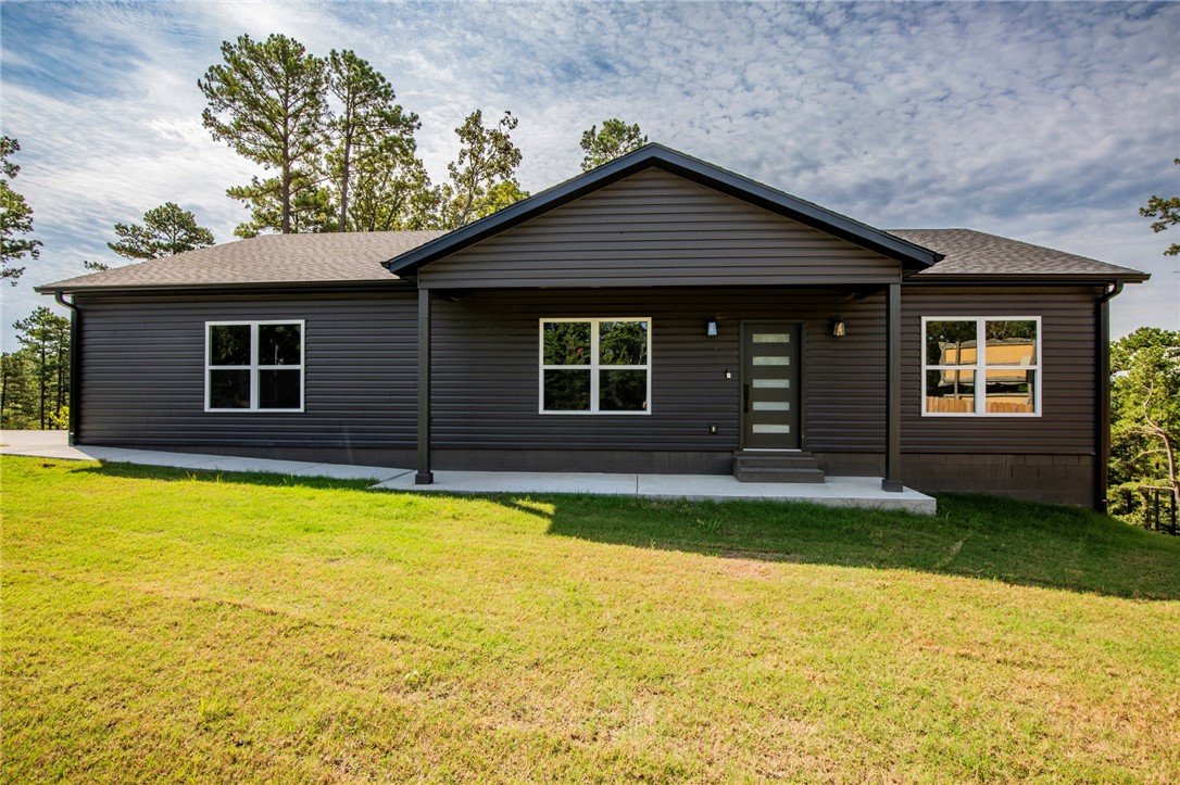 Ready to live the LAKE LIFE?!!!? Charming NEW Construction that is only a few minutes from Beaver Lake at Prairie Creek & around 10 minutes to Downtown Rogers. 3 bedroom, 2 bath, with a 2 car garage. Enjoy the peace & quiet on your covered front porch or back patio. There is also a spot cleared that the new owner could put a 30x30 shop on. This home is a must see!!!