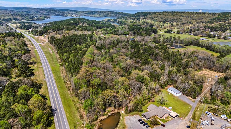 32 +/- acres located at the highly visible corner of Bay Ridge Road and Highway 22 in Dardanelle, Arkansas. This prime tract offers 1,357 feet of Highway 22 frontage, providing excellent visibility and easy access for commercial, residential, or mixed-use development. Electric and water are available at the road, and the property has no restrictions, allowing flexibility for a wide range of uses. Positioned in a growing area near Lyon’s Den Golf Course and just minutes from Lake Dardanelle camping areas and boat launch, this location benefits from steady local and recreational traffic. The corner location and strong highway presence make this property ideal for investors or developers looking to capitalize on growth in this desirable corridor. A rare opportunity to secure acreage with utilities, frontage, and development potential in a strategic location.