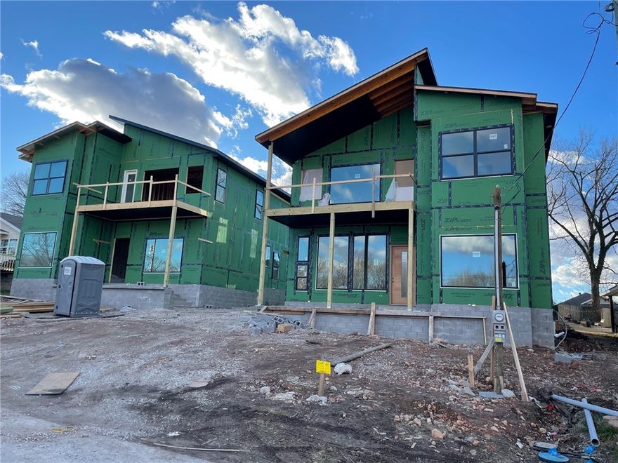 Look out your front door and see the mountain bike trails from this modern new construction home in downtown Bentonville. Peek-A-Boo, Boo Boo & Patti-Cake trail are located right across the street connecting you into Slaughter-Pen and over 80 miles of mountain bike trail or if you are looking to get on the greenway, the trail head on NE A ST is a short walk and you can access the Crystal Bridges Overlook. The Briartown area is exploding with new development. 
This home features modern details from its sloped room design to its cantilevered island and spa like bath. The kitchen is amazing featuring GE Cafe Series appliance including a 36" industrial range along with a 72" built in fridge and a huge pantry with wine storage. The open main living area features 12' ceilings. The owners suite is also on the main level and features 10' ceilings and one of the most amazing showers you have ever seen. Upstairs are 3 large bdrms, a family room, laundry area and an upper deck. The yard is fence plus a 3 car garage.