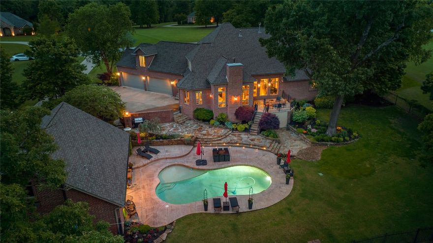 Welcome to a truly one-of-a-kind luxury home on a 3.69-acre lot in Talamore. This magnificent property offers a picturesque setting with a backdrop of majestic woods, stunning landscape, and a custom in-ground pool. As you enter this home, you are captivated by the breathtaking views and the warmth of the hardwood floors throughout. The flow of the living and dining space creates the ideal atmosphere for entertaining guests or enjoying a quiet evening at home. Step into the culinary “Heart of the Home,” adorned with granite countertops and island bar seating. The beautifully designed office is appointed with judges paneling, coffered ceilings, plantation shutters, and abundant storage. The spacious primary suite is on the main floor with a large walk-in closet and luxurious bathroom. The second level boasts three ensuite bedrooms and a large bonus room. The laundry room gives way to the expansive 4-car garage with a 1250 square foot detached building that can be used as a pool house or an additional 3-car garage.