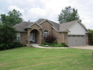 Beautiful large brick home in golf course subdivision w/golf cart garage. Features over 3100 sq ft, 5 BR, 3 BA, 3-sided fireplace in living room, HUGE 25x25 family room, updated garage door. Granite in kitchen & bathrooms. Kitchen entirely replaced a few years ago. Stainless appliances. Jetted tub in master bath. Lrg dining room, updated fixtures throughout home. Privacy fenced yard. Custom tile.