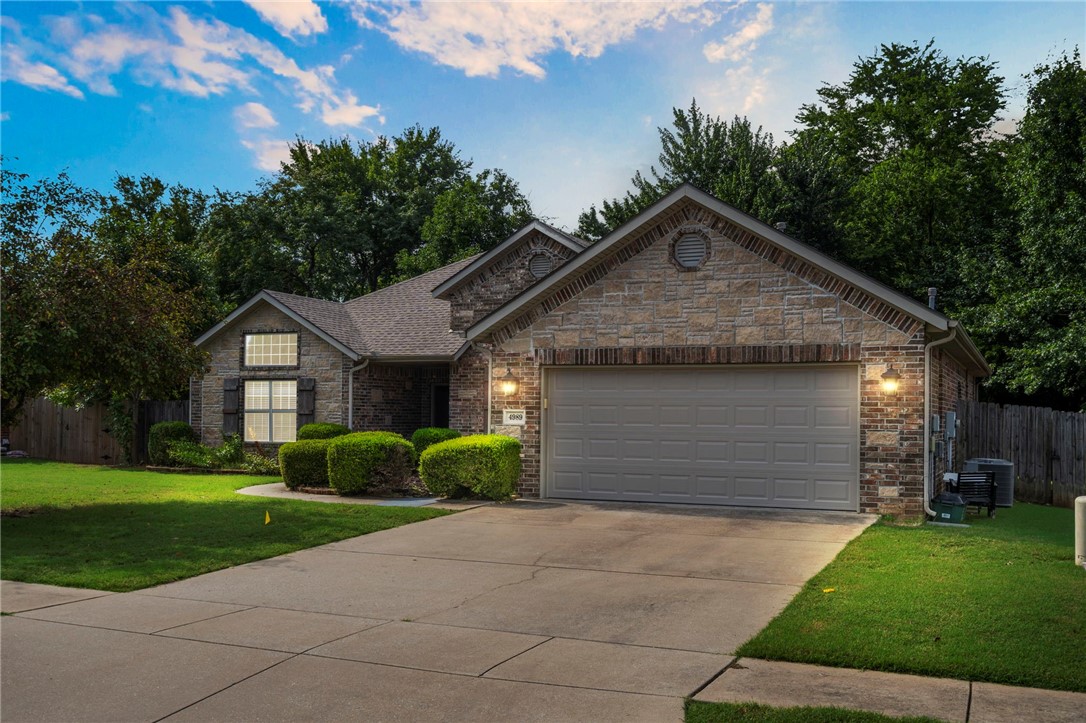 Step into the charm of 4989 W. Homespun Drive, where comfort meets convenience! This 4-bedroom, 2-bath brick-and-stone beauty welcomes you with soaring ceilings framed by crown moulding, elegant archways, a cozy fireplace & a layout that flows effortlessly from the elegant formal dining room to the sunny eat-in kitchen (complete with granite countertops AND fridge included!). Primary bedroom suite w/ tray ceiling & jetted tub provide a welcome retreat. Recent updates like a newer roof & 2024 HVAC let you settle in without a worry, while stylish vinyl wood-look floors & easy-care tile keep life simple. Washer/Dryer convey with sale of home. Your private, fenced backyard has no house behind it! Tucked in a small neighborhood, this home offers the perfect blend of style, space, and location, where you can walk to Woolsey Wildlife Sanctuary & trails, drive 5 min to shops, restaurants and Interstate 49, 5 min to Centennial Park, 10 min to UNIVERSITY OF ARKANSAS, and 15 min to Lake Wedington & Ozark National Forest.