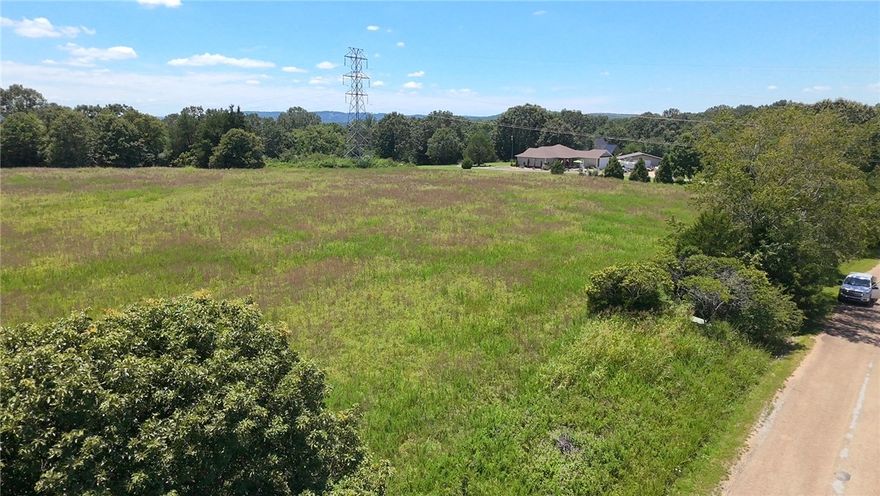 Located in the beautiful Malidia on the River Subdivision in Marion County, this 2.7-acre property includes Lots 21 and 30. While not directly riverfront, it sits just across the road from the White River, offering easy access and scenic potential. With water and electric at the road, it's build-ready—ideal for a primary residence, vacation home, or weekend getaway. A septic system will be required. The land is nearly level with paved road frontage and plenty of space to spread out. Enjoy nearby fishing, boating, and the natural beauty of the Ozarks, all within a peaceful, rural setting. This is your chance to own a spacious slice of land near one of Arkansas’s most treasured rivers. Access to property from CR 7005 and White Hole Rd.