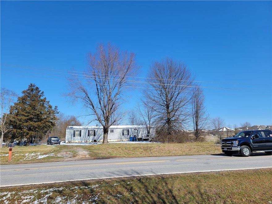 Excellent location!!! 250' of Highway 72 frontage, 1373' deep, Possible commercial and or development property. Property zoned residential, Mobile home and portable building is of no value. Value is in land only.