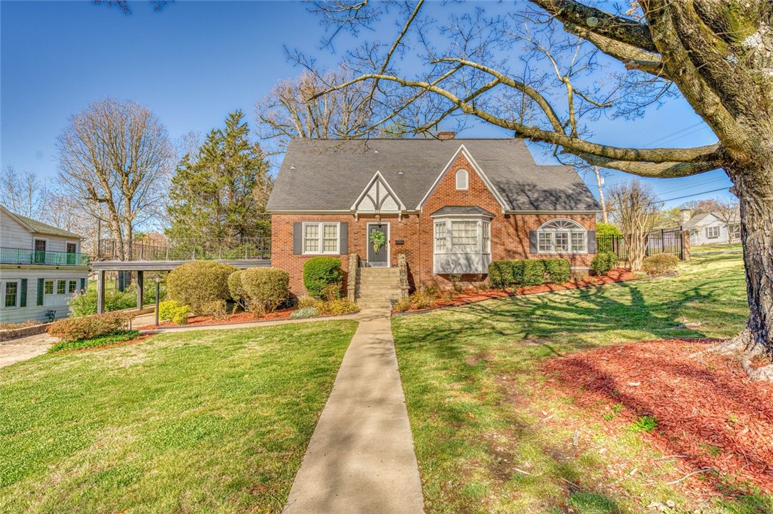 Nestled in the heart of a vibrant community. This captivating Tuder home exudes charm and elegance. Boasting a timeless two story design complemented by a finished basement. This residence offers a total of 4BR/2BA encompassing 3178 sqft. Step inside to discover a warm ambiance accentuated by a gas fireplace, hardwood floors, plush carpeting throughout, comfy sunroom, cedar closets, & tons of storage. Entertain on the expansive deck surrounded by mature trees and black wrought iron fence. Experience the allure of this enchanting home first hand, schedule a viewing today and prepare to fall in love!