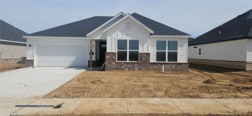 Great new construction home in Towne West S/D. The 'Arkansas' plan features 4 bedrooms, 2 bathrooms, wood floors, quartz countertops, split floor plan, stainless steel appliances in kitchen, LVP flooring, linear fireplace in large living room, open kitchen with pantry, large master suite complete with huge walk in closet, separate shower & double vanity. Covered back patio, fenced in yard,& much more! Come take a look!