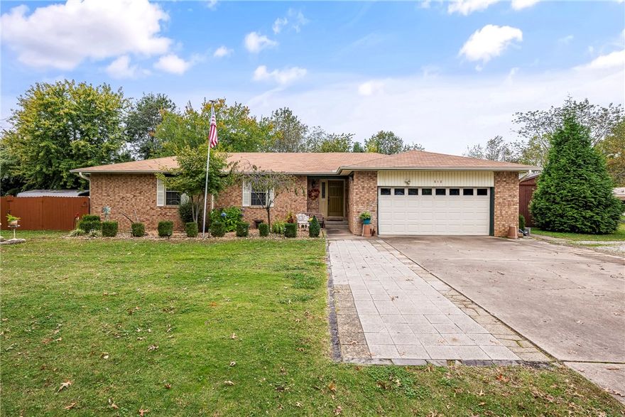 Charming Brick Home on a 1.33 Acre Corner Lot in Lowell! Discover this unique and well-maintained older brick home just on the brinks of South Rogers, offering ample space and potential. This property features spacious room, a cozy wood-burning stove, and a convenient W/I pantry. Enjoy a brand-new HVAC system, newer roof, gutters and windows. Outdoor amenities include RV pad complete w/septic hookup & electric, a covered deck and a large patio perfect for entertaining! The property also boasts a workshop w/roll-up door & electric, three carports & an oversized two-car garage, alongside a 32 x 12 Derksen barn for additional storage or workspace. With potential for future rezoning to C2- this property is ideally located near restaurants, shopping, I49, the Razorback Greenway Trail, hospitals and schools. So many opportunities to make this property your own! Don't miss your change to own this exceptional home in a fantastic location!