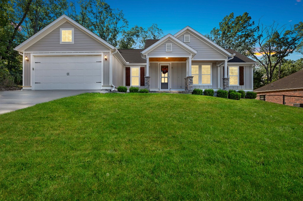 This charming home is ideally located just moments from Highway 71, providing easy access to biking trails, lakes, and golf courses. Situated on a peaceful dead-end street, this impressive 3-bedroom, 2-bathroom residence features a welcoming open-concept layout that seamlessly integrates the living, dining, and kitchen areas. The inviting living room showcases a stunning glass log fireplace and large windows that fill the space with natural light. The modern kitchen is equipped with top-of-the-line stainless steel appliances, including a gas stove and refrigerator, ensuring a delightful cooking experience. The primary bedroom includes two very spacious walk-in closets and a spa-like retreat bath. Beautiful wood floors add warmth and character throughout the home. The generous fenced backyard offers breathtaking woodland views, making it ideal for relaxation and entertaining. Additionally, there is a concrete pad available for RV parking & connected to sewer.