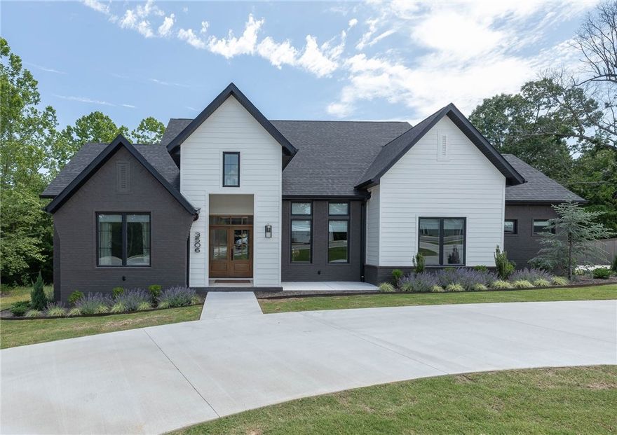 This Custom Built New Modern Stunner is ready for you! Tasteful and modern choices throughout, this home boasts hardwoods and gorgeous tile. Charge up your EV with two charging ports in the oversized garage: 240 volt, 50 amp. Relax upstairs in the media room with inset speakers and plenty of room for friends or family. The well fitted kitchen has a gorgeous attached Butler's Pantry with a wine fridge, oven and plenty of storage. Great setup for entertaining or traffic flow on those family Holidays. Every bedroom has its own bathroom attached. Enjoy endless hot water thanks to the tankless water heater. Gorgeous views from your back porch with fireplace and connections for TV, broadband etc. This home is insulated with spray foam. Attic and walk in storage aplenty. Home is wired for sound in living, kitchen and office. The dedicated office is perfect for working from home or spreading out the company while entertaining. This home is set up on a one acre half cleared lot and boasts privacy and nature out of the rear.