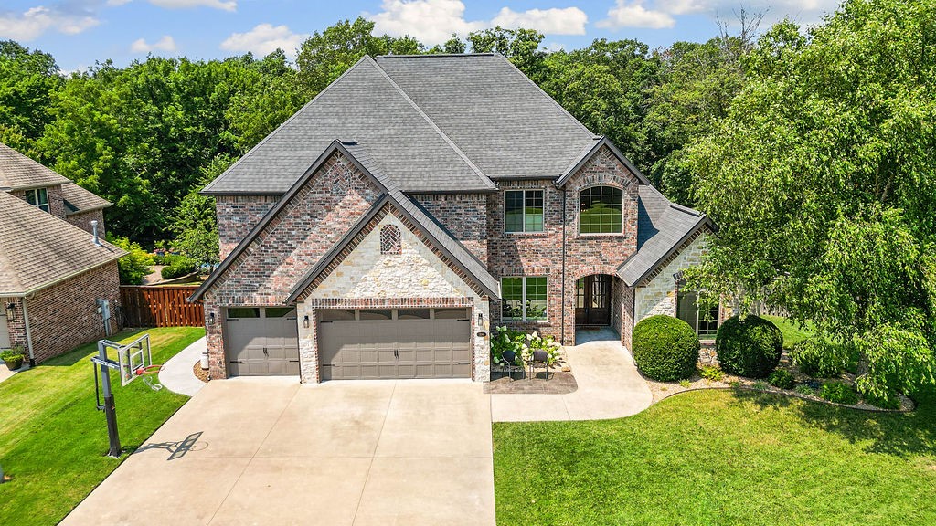 Located in the prestigious gated community of Oak Tree, this impeccably maintained, lightly lived in home combines comfort, style, and functionality. The open concept design features a gourmet kitchen with granite countertops, stainless steel appliances, a double oven, and a spacious island, seamlessly flowing into the living and dining areas. A formal dining room provides an elegant space for entertaining, while a dedicated executive office offers the perfect setting for working from home. The primary suite is conveniently situated on the main level, while a mudroom and large laundry room add extra convenience to daily life. Step outside to a covered patio with extended coverage and seating, overlooking a beautiful in-ground pool and mature trees that provide a serene and private backdrop. With its blend of luxury finishes, thoughtful layout, and a tranquil outdoor retreat, this home offers the best of low maintenance living in one of the area’s most sought after gated neighborhoods.