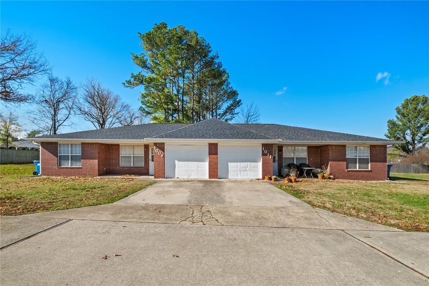 Fantastic location on an oversized .45 acre lot.  Duplex near downtown Bentonville featuring 2bed/2bath/1 car garage units.  Great investment in superior Bentonville location.  Additional duplex also available at same price next to this listing.  Unit 1011 is tenant occupied.  Please do not disturb tenants.  Unit 1009 is vacant and may be shown.  There are no other duplex offerings in this Bentonville core location at this price point.