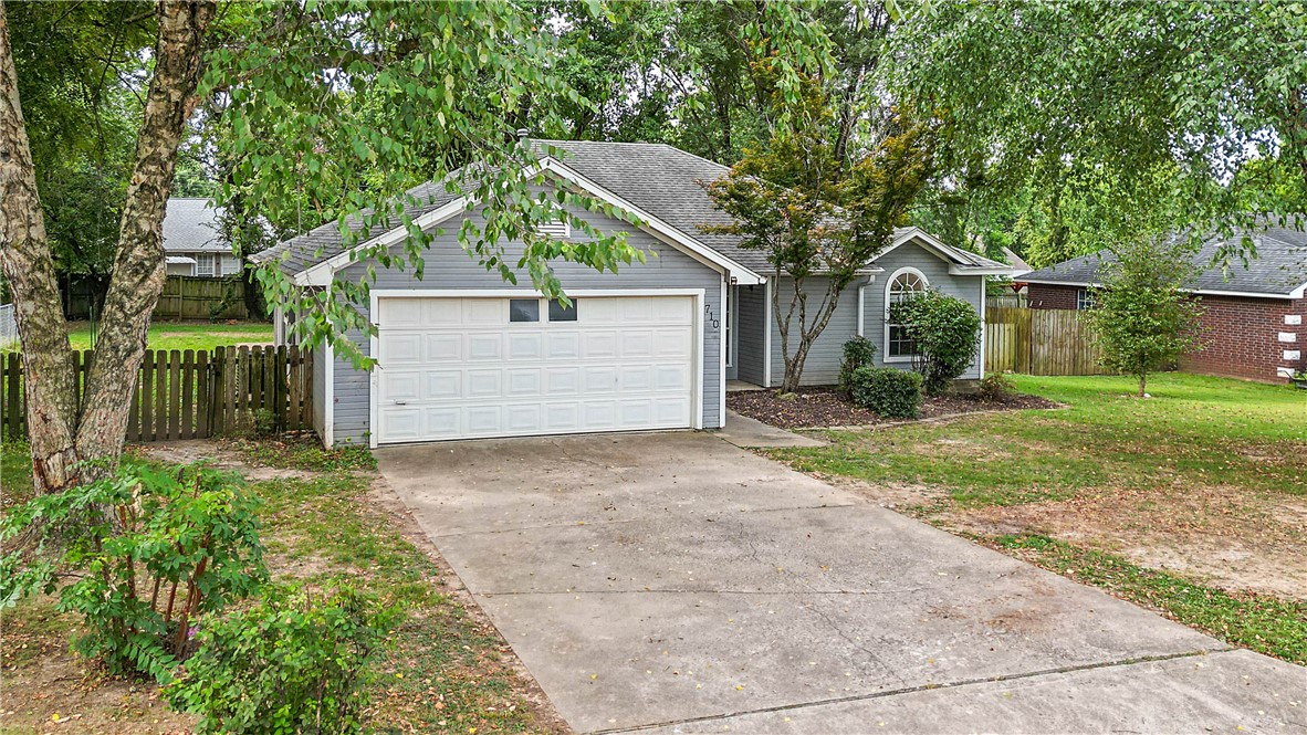 It seems to only be getting harder to find something in this price range in NWA, especially with a location this convenient to everything the area has to offer. Lowell sits right in the middle of the i49 corridor making it a convenient place for anyone commuting toward Fayetteville or toward Bentonville. This 3 bed and 2 bath home sits at the front of the subdivision on a lot that feels encompassed in privacy due to mature trees and neighbors at a good distance. A tall vaulted ceiling with plenty of windows makes for a welcoming entrance along with the newly painted walls and ceilings. The primary bedroom has a large bathroom complete with two closets. A two car garage and a fenced backyard make the package complete. Take the quick drive off exit 78 to see this home and make an appointment today! Youtube walk through video available upon request