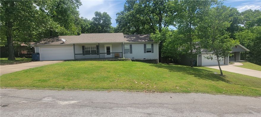 Great opportunity to update and make this home your own—whether as a primary residence, second home, or investment property. 3 bedroom and 2 bath single-level home offers just under 1,400 sq. ft. with a flat front yard and gentle backyard slope. The back deck was recently redone, creating a great outdoor space to enjoy. Conveniently located just 1.9 miles from Hwy 71 via Trafalgar for easy access in all directions. Major updates include HVAC replaced 5 years ago and water heater 4 years ago. Inside, the spacious living room with high ceilings flows nicely into the kitchen and dining area. Enjoy Bella Vista amenities including 7 golf courses, 7 lakes, tennis, pickle ball, clubhouses, hiking and mountain biking trails, plus the future chair lift at OZ Trails Bike Park less than 4 miles away.