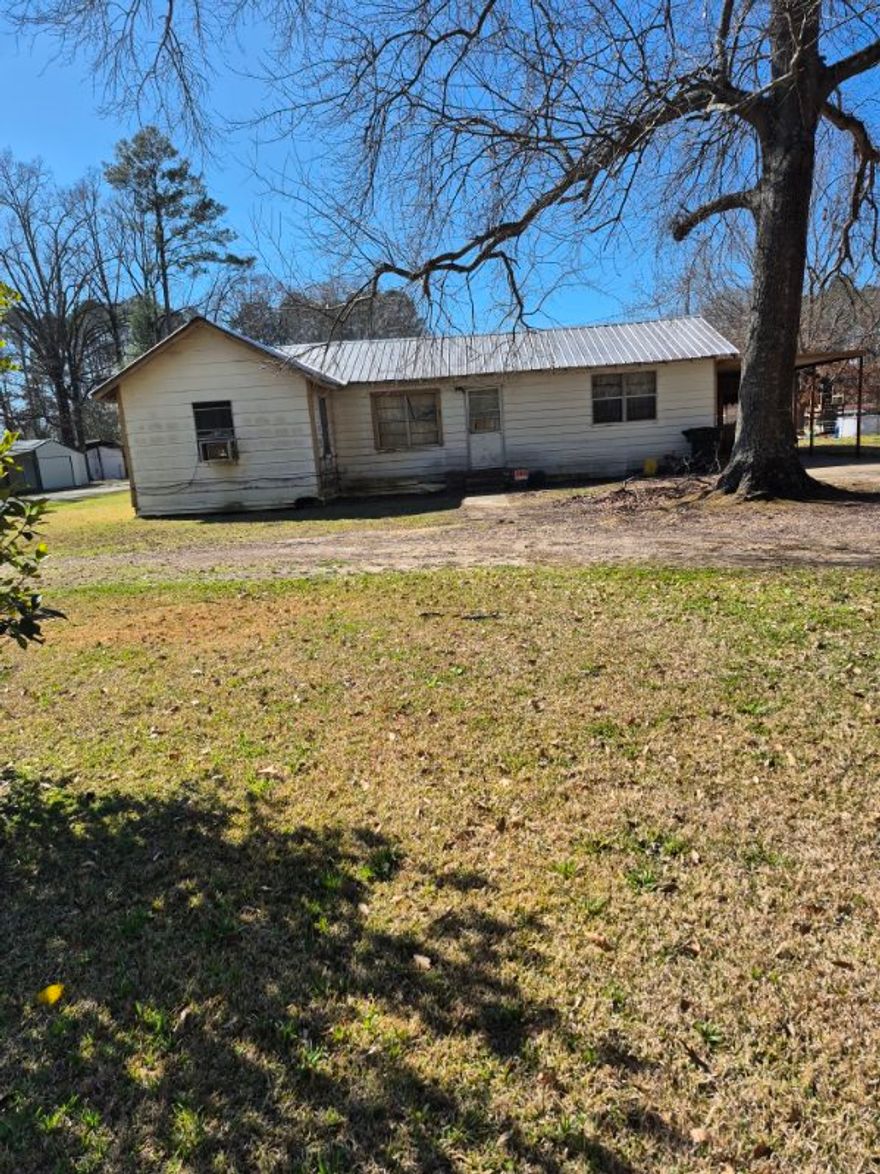 Bring your toolbelt! Opportunity awaits on this 3-bedroom, 1-bath fixer-upper situated on two spacious lots totaling approximately 0.73 acres. With plenty of room to expand, garden, or create your dream outdoor space, this property offers endless potential for investors, flippers, or buyers looking to add their personal touch. The home features a functional layout and solid footprint ready for renovation and updates. Enjoy the privacy and extra space rarely found at this price point. Whether you’re searching for your next project or a property with room to grow, this one is full of possibilities.