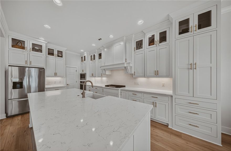 This stunning home truly has it all — location, style, and luxury! Ideally situated just steps from Mt. Hebron City Park, and close to HWY 49 and XNA, on a spacious 0.34-acre corner lot with a privacy fence and an oversized three-car garage.  Meticulously maintained and ready for move-in..

Built in 2023 and upgraded to perfection, this home feels brand new but with thoughtful enhancements. Upgrades include COREtec LVP flooring in the primary suite, over $20K in custom cabinetry and a full walk-in pantry, and an epoxy garage floor. A generator hookup (gas/propane compatible). The main level features a spacious primary suite, a guest bedroom, and a versatile office or sitting room with elegant double doors. The gourmet kitchen is a chef’s dream, showcasing a gas range, a walk-in pantry, and a large Quartz island. Upstairs, you’ll find two additional bedrooms, a Large flex room, 1.5 baths, and ample attic storage in two reinforced areas. Modern, upgraded, and perfectly located — this home is the complete package!